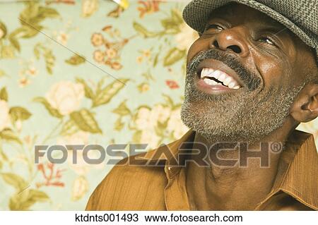 Middle aged man laughing for the camera View Large Photo Image Stock Image - Middle aged man laughing for the camera. Fotosearch