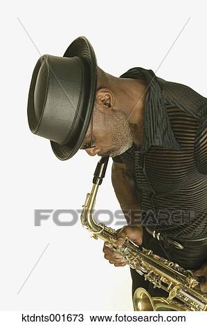 Middle aged man playing the saxophone View Large Photo Image Stock Image - Middle aged man playing the saxophone. Fotosearch