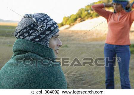 Rear view of couple wearing stocking caps View Large Photo Image Stock Image - Rear view of couple wearing stocking caps. Fotosearch