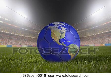 Soccer ball painted like a globe resting on grass in large stadium View Large Photo Image Stock Image - Soccer ball painted like a globe resting on grass in large stadium. Fotosearch