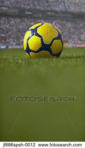 Soccer ball resting on grass View Large Photo Image Stock Image - Soccer ball resting on grass. Fotosearch