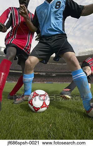 Stock Image - Soccer player blocking the ball. Fotosearch