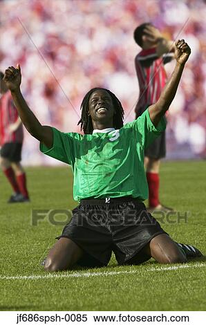 Soccer player celebrating goal View Large Photo Image Stock Photography - Soccer player celebrating goal. Fotosearch