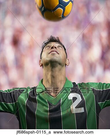 Soccer player heading the ball View Large Photo Image Stock Image - Soccer player heading the ball. Fotosearch