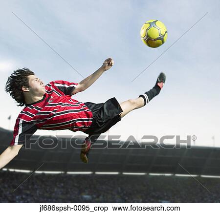 Soccer player making aerodynamic kick View Large Photo Image Stock Photography - Soccer player making aerodynamic kick. Fotosearch