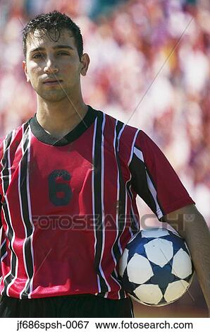 Stock Photo - Soccer player posing for the camera. Fotosearch