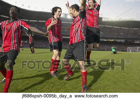 Soccer players celebrating a goal View Large Photo Image Stock Image - Soccer players celebrating a goal. Fotosearch