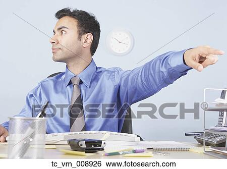 Young businessman pointing View Large Photo Image Stock Photograph - Young businessman pointing. Fotosearch