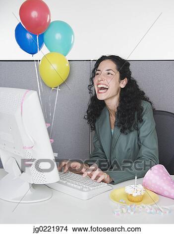 Young businesswoman having birthday celebration at work View Large Photo Image Picture - Young businesswoman having birthday celebration at work. Fotosearch