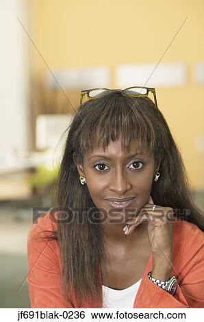 Stock Photograph - Young businesswoman posing for the camera. Fotosearch