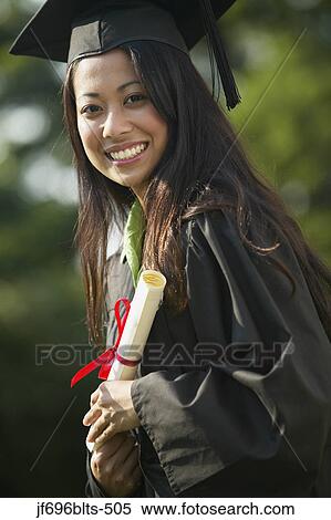 Stock Photography - Young woman graduating. Fotosearch