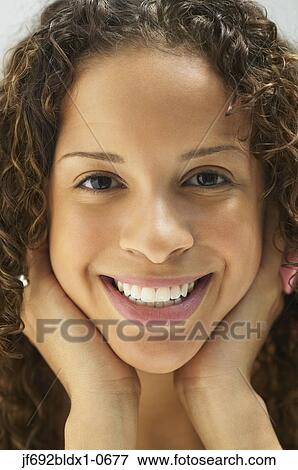 Stock Photo - Young woman posing for the camera. Fotosearch