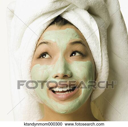 Young woman with face mask on View Large Photo Image Stock Image - Young woman with face mask on. Fotosearch