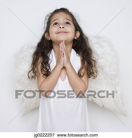 Stock Photo - Angel girl praying. Fotosearch