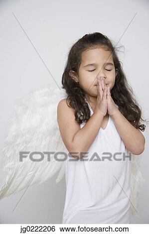 Stock Photograph - Angel girl praying. Fotosearch