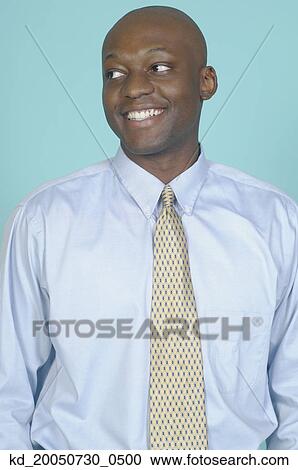 Businessman smiling for the camera View Large Photo Image Stock Image - Businessman smiling for the camera. Fotosearch