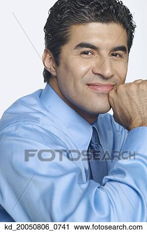 Stock Image - Businessman smiling for the camera. Fotosearch