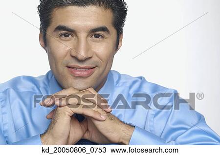 Businessman smiling for the camera View Large Photo Image Stock Image - Businessman smiling for the camera. Fotosearch