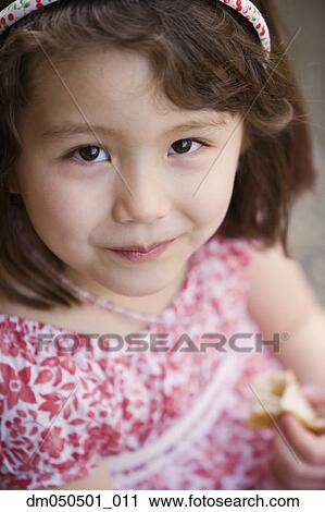 Close up portrait of girl eating View Large Photo Image Stock Image - Close up portrait of girl eating. Fotosearch
