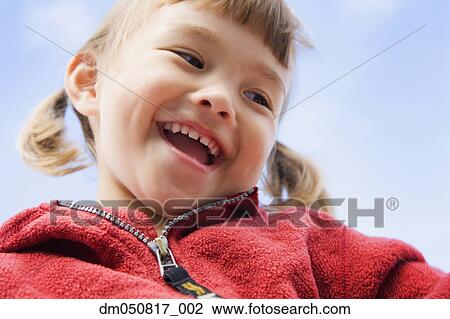 Close up portrait of young girl laughing View Large Photo Image Stock Image - Close up portrait of young girl laughing. Fotosearch