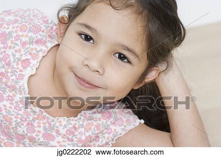 Stock Image - Close up portrait of young girl. Fotosearch