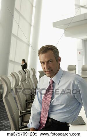 Portrait of businessman in conference room View Large Photo Image Stock Photography - Portrait of businessman in conference room. Fotosearch