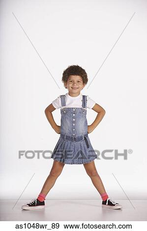Portrait of girl standing with hands on hips View Large Photo Image Stock Photo - Portrait of girl standing with hands on hips. Fotosearch