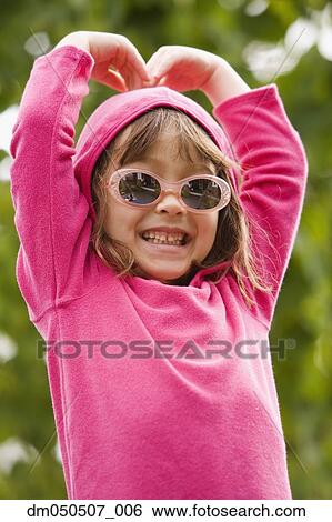 Stock Photograph - Portrait of girl wearing sunglasses . Fotosearch