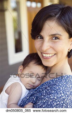 Portrait of mother with sleeping baby View Large Photo Image Stock Photography - Portrait of mother with sleeping baby. Fotosearch