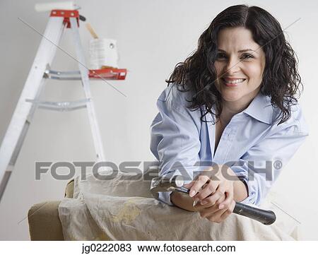 Portrait of woman holding hammer View Large Photo Image Stock Image - Portrait of woman holding hammer. Fotosearch