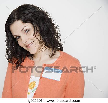 Picture - Portrait of woman with name tag on . Fotosearch