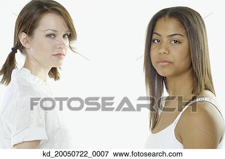 Stock Photo - Teenage girls posing for the camera. Fotosearch