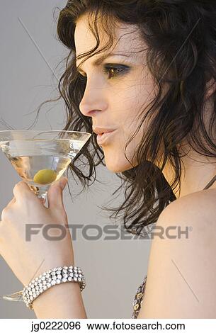 Woman drinking martini View Large Photo Image Stock Photograph - Woman drinking martini. Fotosearch