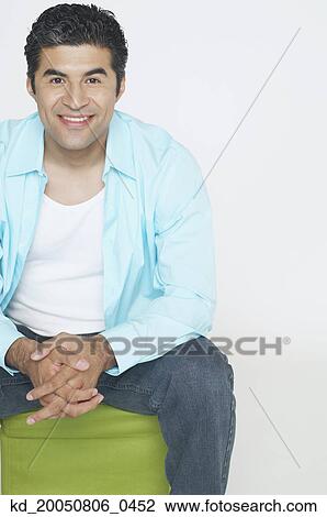 Stock Image - Young man smiling for the camera. Fotosearch