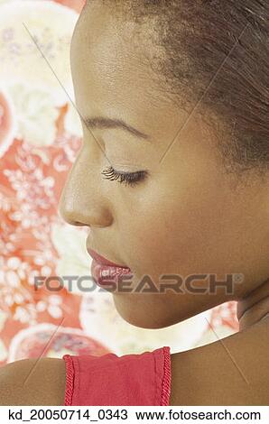Young woman looking over her shoulder View Large Photo Image Stock Image - Young woman looking over her shoulder. Fotosearch