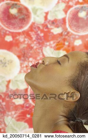 Young woman making a kissy face at nothing View Large Photo Image Stock Image - Young woman making a kissy face at nothing. Fotosearch