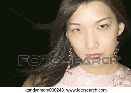 Young woman posing for the camera View Large Photo Image Stock Image - Young woman posing for the camera. Fotosearch