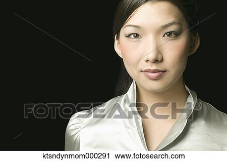 Young woman posing for the camera View Large Photo Image Stock Image - Young woman posing for the camera. Fotosearch