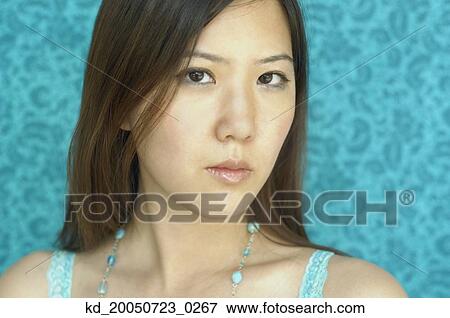 Young woman posing for the camera View Large Photo Image Stock Photo - Young woman posing for the camera. Fotosearch