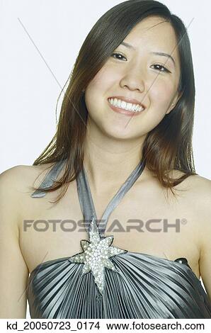Picture - Young woman smiling for the camera. Fotosearch