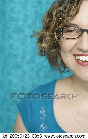 Young woman smiling for the camera View Large Photo Image Stock Image - Young woman smiling for the camera. Fotosearch