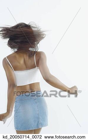 Young woman spinning View Large Photo Image Stock Image - Young woman spinning. Fotosearch