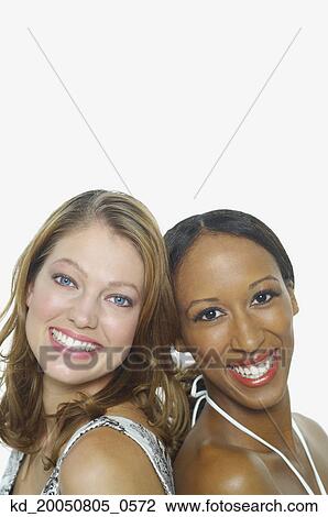 Stock Image - Young women smiling for the camera. Fotosearch