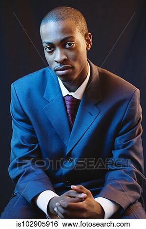 Stock Photograph - Businessman posing for the camera. Fotosearch