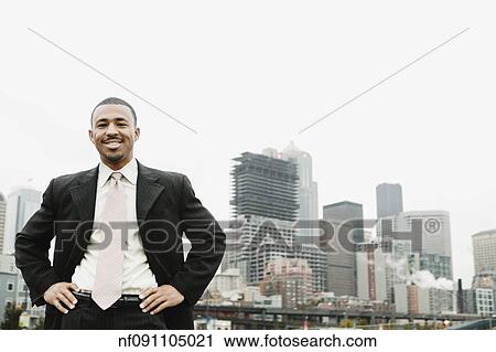 Businessman smiling for the camera View Large Photo Image Stock Image - Businessman smiling for the camera. Fotosearch