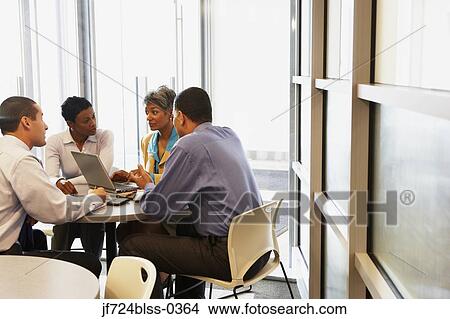 Businesspeople having a meeting View Large Photo Image Picture - Businesspeople having a meeting. Fotosearch