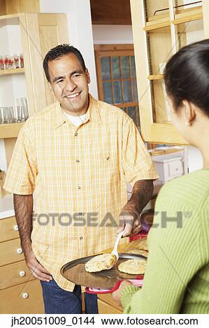 Couple cooking together View Large Photo Image Picture - Couple cooking together. Fotosearch