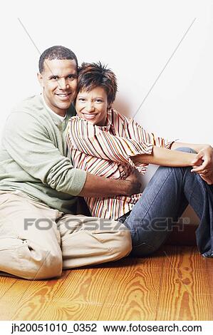 Couple hugging each other View Large Photo Image Stock Image - Couple hugging each other. Fotosearch
