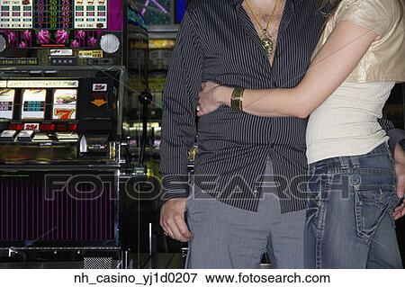 Couple hugging in a casino View Large Photo Image Stock Photo - Couple hugging in a casino. Fotosearch