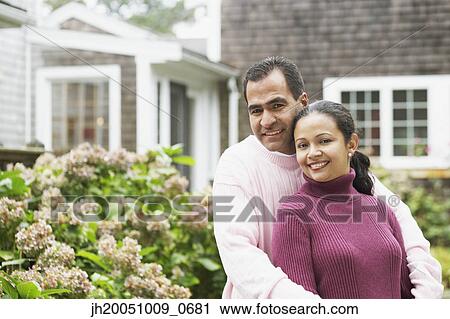 Couple hugging outdoors View Large Photo Image Stock Image - Couple hugging outdoors. Fotosearch